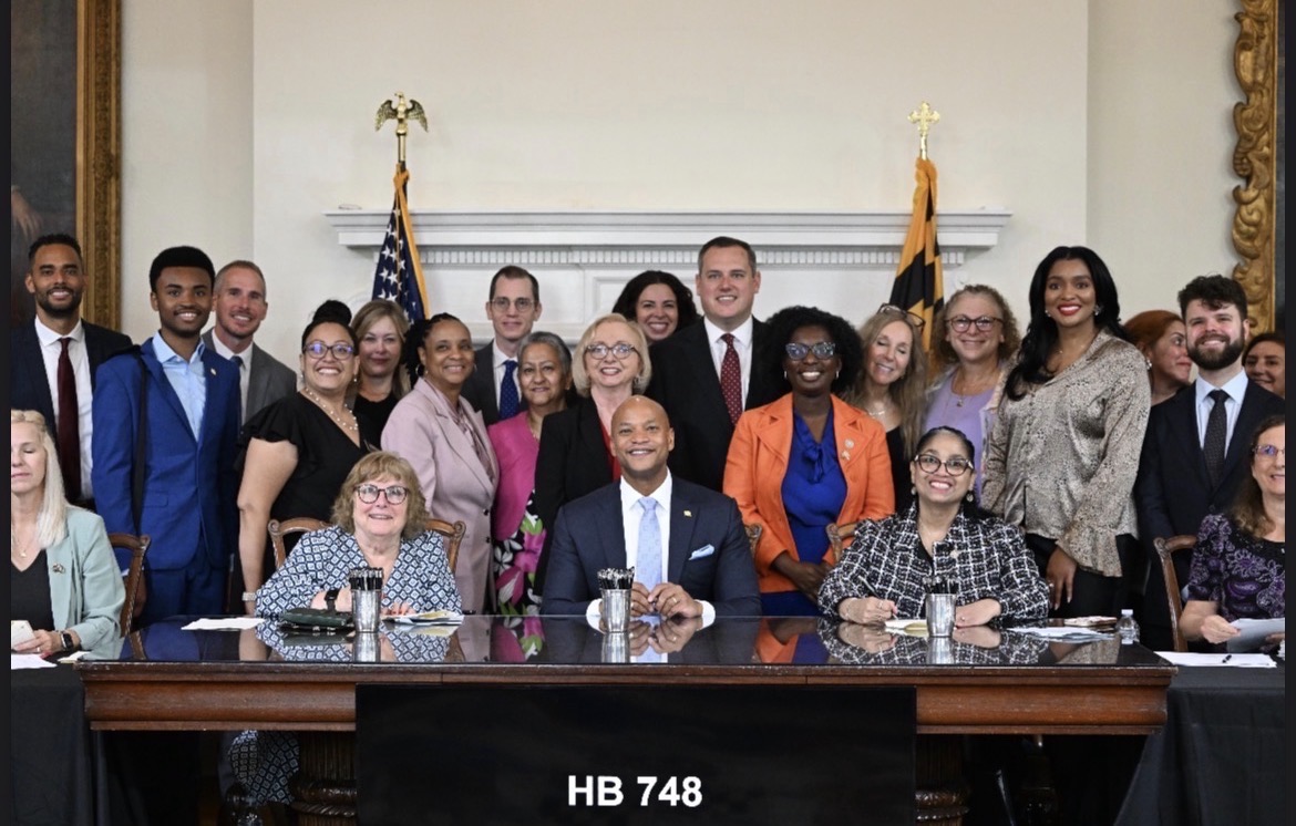 Yvonne Harper at HB 748 bill signing ceremony with Governor Wes Moore
